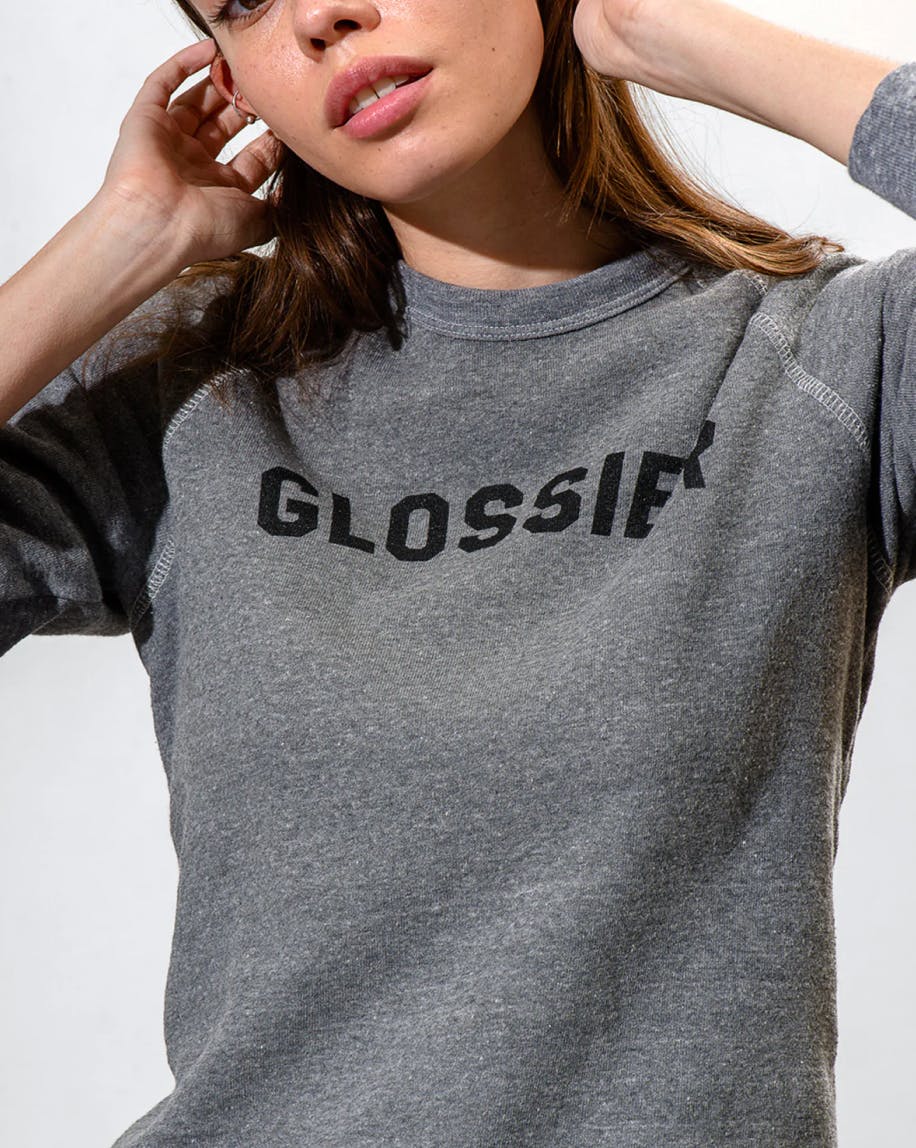 Madeleine wears the Glossier Sweatshirt.